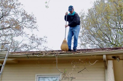 Sweeping off the roof. Sweeping off the roof.