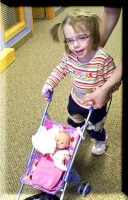 Ellie Pushing Her Doll Buggy