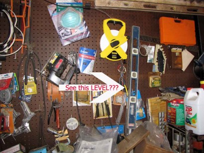 Level hanging on pegboard.