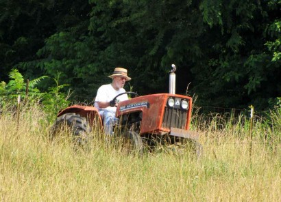 The Farmer on his tractor. picture of man on tractor