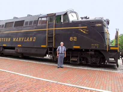 The Farmer by Cheat Mountain Salamander train. man beside engine of Cheat Mountain Salamander train